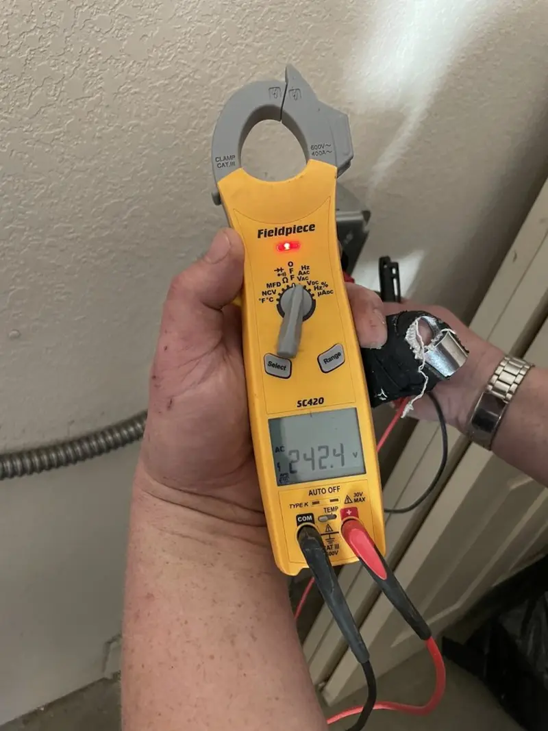 Voltage testing with clamp meter during Electrical Installation Services in Galax